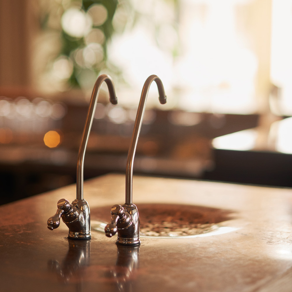 close up of the Copper Eau de Vie taps on the waiter station at The Gallivant Hotel