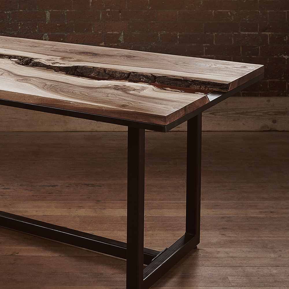 The elm and copper live edge dining table with industrial black steel legs
