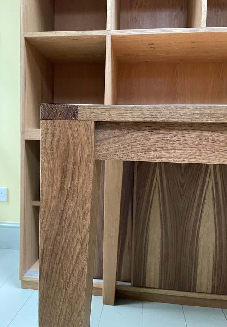 close up of the oak table joinery that extends from the oak kitchen dresser