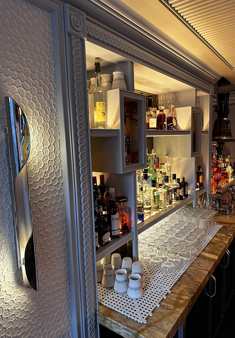 close up view of the first floor back bar at gaia London, specialist mouldings and bespoke joinery to display the bottles.